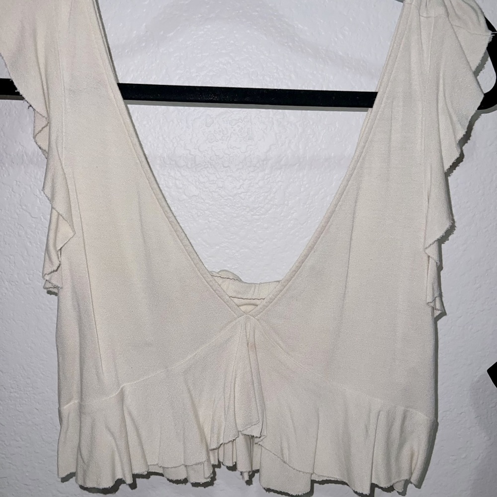 Cream crop with ruffle shoulders from Urban Outfitters